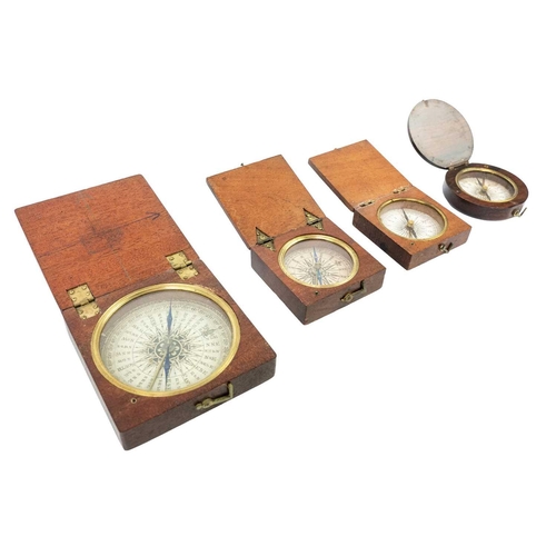 311 - A 19th century travel compass with printed card dial in a square oak case. 5.5cm, Together with thre... 