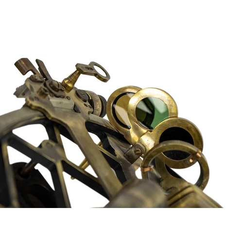 316 - A lacquered brass sextant. Stamped Henry Hughes Son, London, width 23cm.