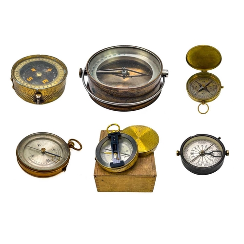 320 - A brass dip needle compass. Diameter 9.5cm together with five various compasses. (6)