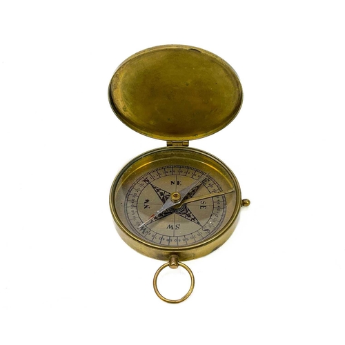 320 - A brass dip needle compass. Diameter 9.5cm together with five various compasses. (6)