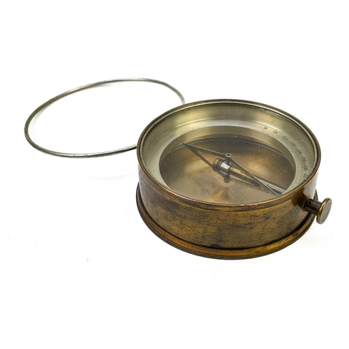 320 - A brass dip needle compass. Diameter 9.5cm together with five various compasses. (6)