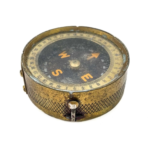 320 - A brass dip needle compass. Diameter 9.5cm together with five various compasses. (6)