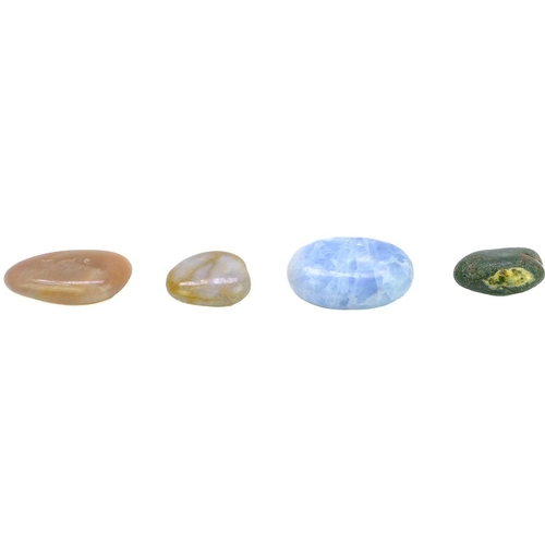 34 - A collection of polished minerals. To include; Petrified wood, blue calcite, polychrome jasper, ocea... 