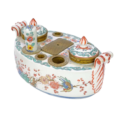 340 - A French porcelain inkstand in the Kakiemon palette circa 1900. Length 18cm together with a pair of ... 