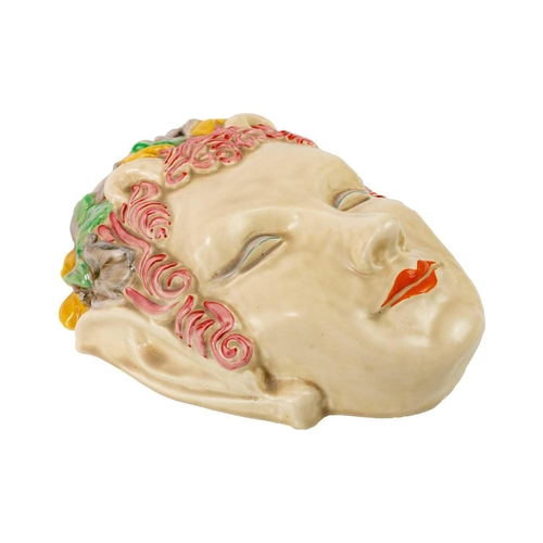 351 - A Clarice Cliff Pan or Puck wall mask. Wilkinsons Ltd mark, length 23cm. Some crackle to glaze. No o... 