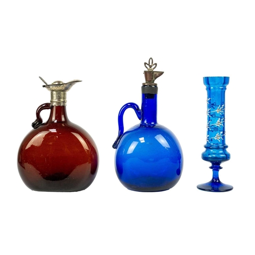 363 - A Victorian blue glass wine flask. The metal spout with twist stopper, height 23cm, together with a ... 