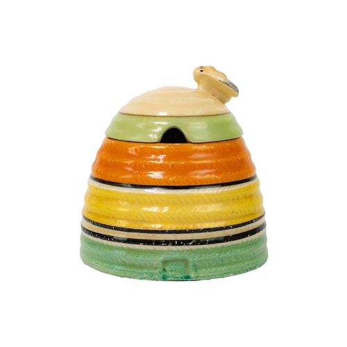 374 - A Clarice Cliff banded beehive honey pot and cover. Bizarre Newport Pottery marks, height 9.5cm.