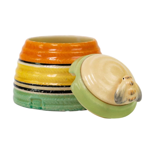 374 - A Clarice Cliff banded beehive honey pot and cover. Bizarre Newport Pottery marks, height 9.5cm.