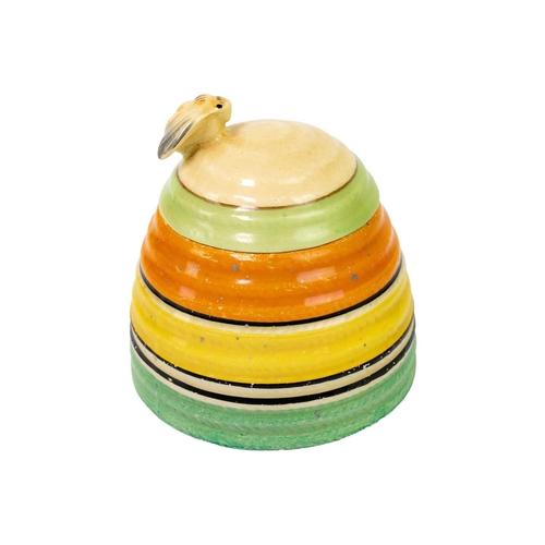 374 - A Clarice Cliff banded beehive honey pot and cover. Bizarre Newport Pottery marks, height 9.5cm.