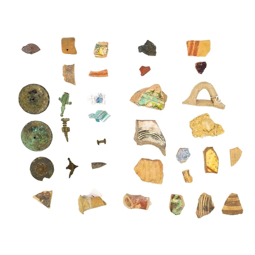 38 - A group of Cypriot pottery shards and glass fragments. Together with various bronze items including ... 