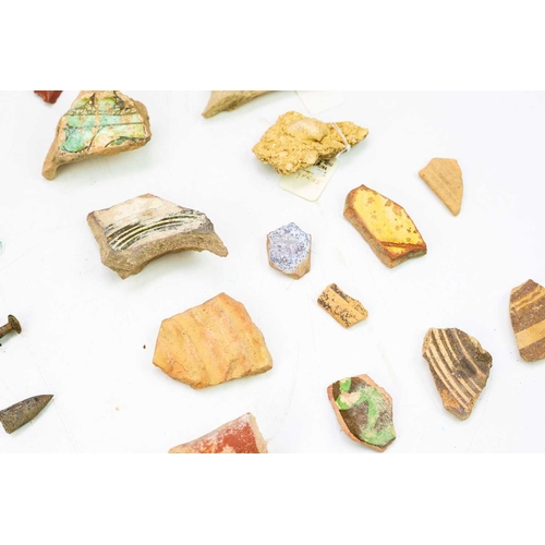 38 - A group of Cypriot pottery shards and glass fragments. Together with various bronze items including ... 