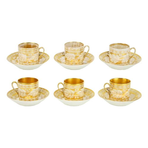 388 - A set of six gilt decorated coffee cans and saucers. Possibly Coalport, circa 1820, decorated with f... 