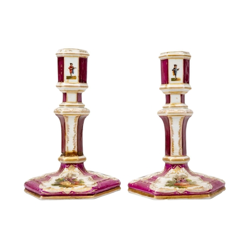 391 - A pair of late 19th/early century KPM Berlin porcelain candlesticks of hexagonal form. Decorated wit... 