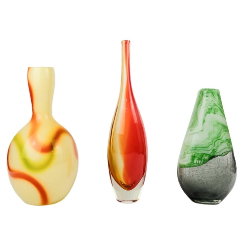 393 - An art glass bottle vase in orange and yellow. Height 41cm together with two other art glass vases. ... 