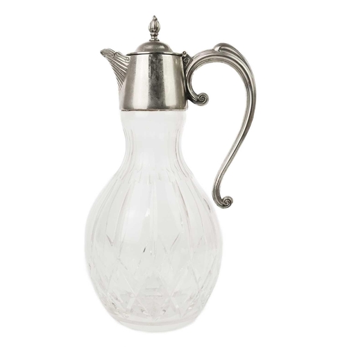 394 - A cut glass claret jug. Height 32cm.