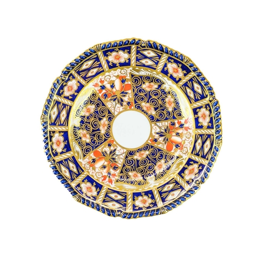 396 - A pair of Royal Crown Derby Imari pattern porcelain plates. Diameter 22.5cm, together with a cup and... 