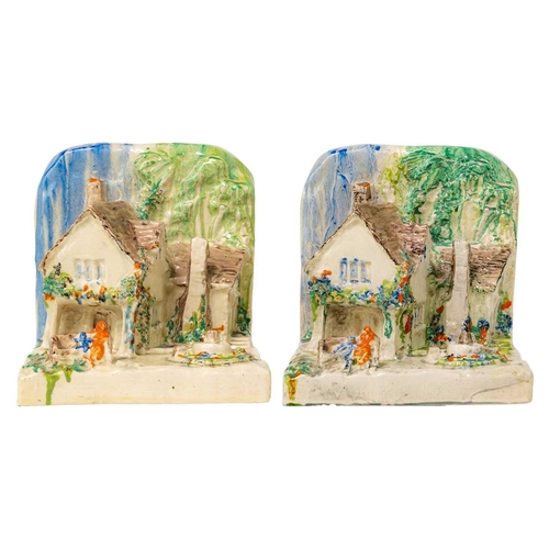 397 - A pair of Clarice Cliff cottage bookends shape 411. In Delicia pallete Bizarre Newport Pottery and W... 