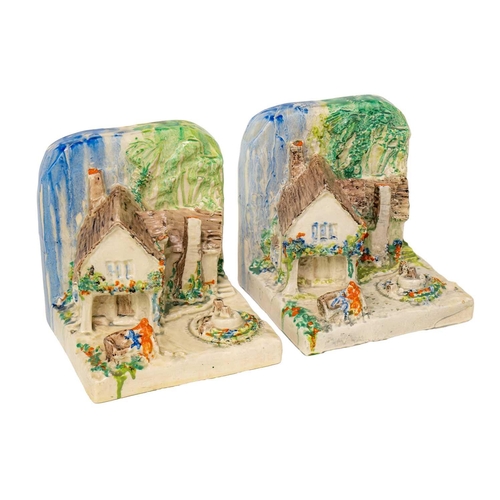 397 - A pair of Clarice Cliff cottage bookends shape 411. In Delicia pallete Bizarre Newport Pottery and W... 