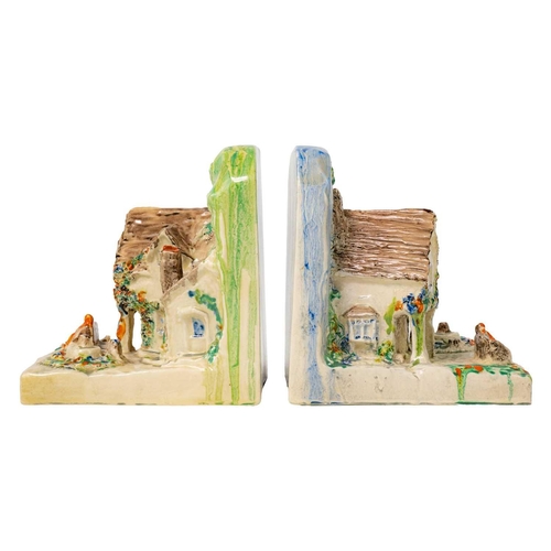 397 - A pair of Clarice Cliff cottage bookends shape 411. In Delicia pallete Bizarre Newport Pottery and W... 