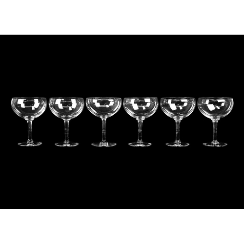 399 - A suite of eleven champagne coupes. Height 10.75cm, together with a set of eight large champagne cou... 