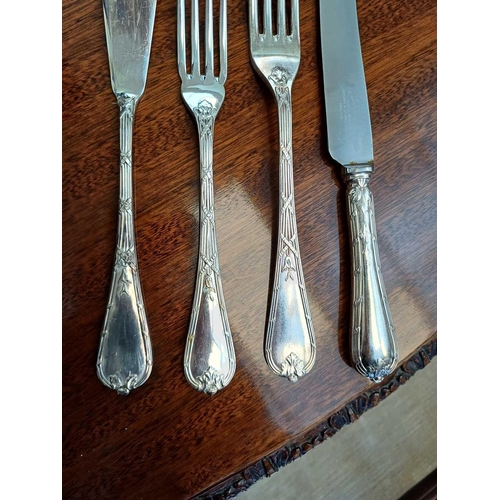 40 - An Elkington & Co silver plated canteen. Ribbon and thread pattern, eight place settings, in a 1930s... 