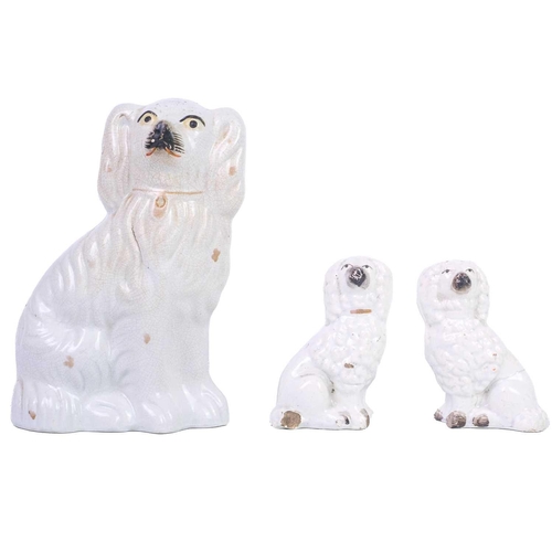 402 - A pair of Staffordshire liver and white spaniels. Height 31cm, together with three other pairs and s... 