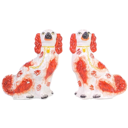 402 - A pair of Staffordshire liver and white spaniels. Height 31cm, together with three other pairs and s... 