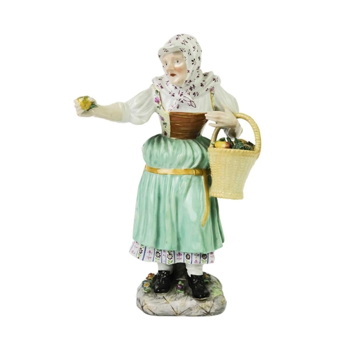 410 - A late 19th century Meissen porcelain figure of an apple seller. Crossed swords and impressed 977 ma... 