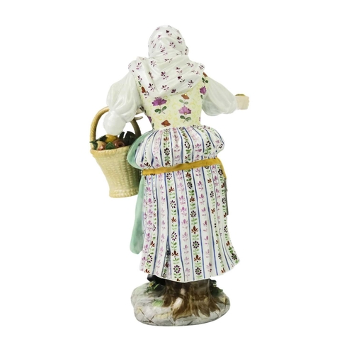 410 - A late 19th century Meissen porcelain figure of an apple seller. Crossed swords and impressed 977 ma... 