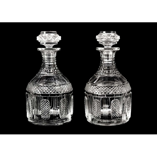 413 - A pair of Georgian design cut glass decanters and stoppers. Circa 1900, with hobnail cut panels, hei... 