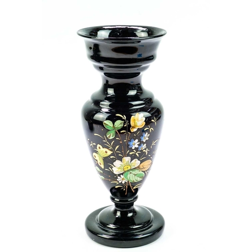 416 - An aesthetic movement pottery bottle vase and cover. In black glaze and highlighted in gilt, height ... 