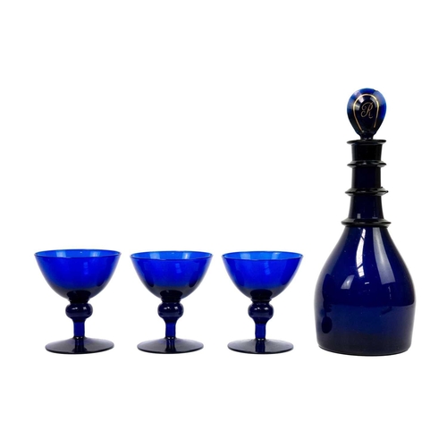 417 - A 19th century Bristol Blue glass rum decanter. With triple ring neck, and initialled stopper. Heigh... 