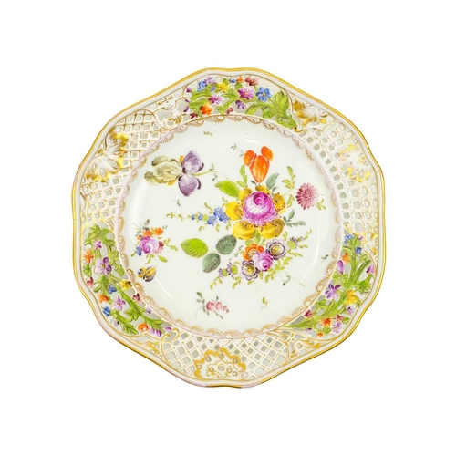 427 - A pair of Carl Thieme Potschappel ribbon plates. Late 19th century, with floral painted bouquets and... 