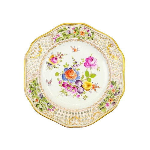 427 - A pair of Carl Thieme Potschappel ribbon plates. Late 19th century, with floral painted bouquets and... 