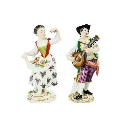 429 - A Meissen porcelain figure of a lute player. On rococo scroll base, height 14cm together with a Meis... 