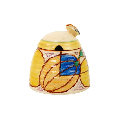 430 - A Clarice Cliff Melon pattern beehive honey pot and matched cover. Fantasque Bizarre Newport Pottery... 