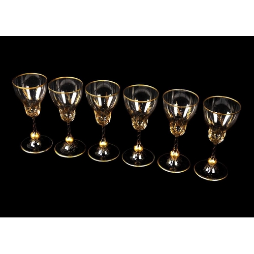 435 - A set of six gilt decorated sherry glasses. Circa 1930, the bowls decorated in gilt with grasses, th... 