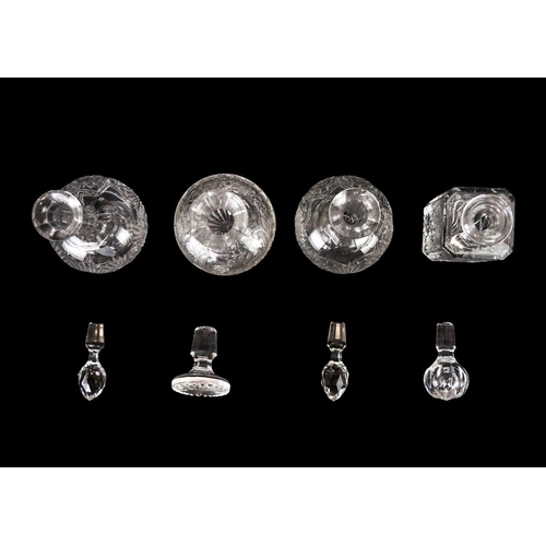 437 - A pair of shaft and globe cut glass decanters and stoppers. 1920s, together with four wines and four... 