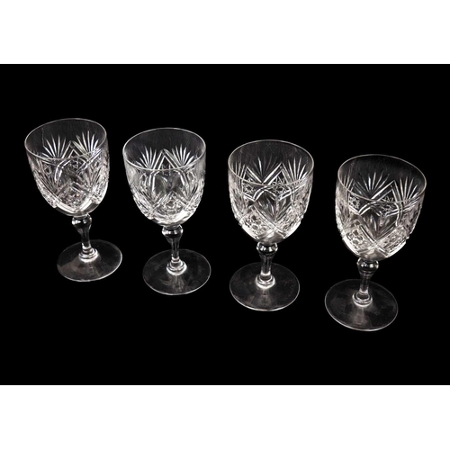 437 - A pair of shaft and globe cut glass decanters and stoppers. 1920s, together with four wines and four... 