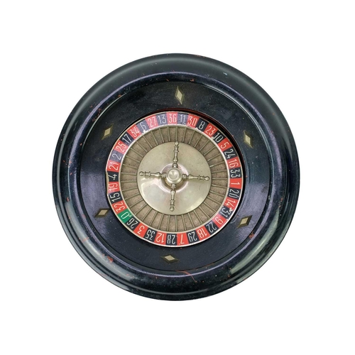 44 - A table top roulette spinning wheel by R.P. & F. Paris. Diameter 35cm, together with a child's toy s... 