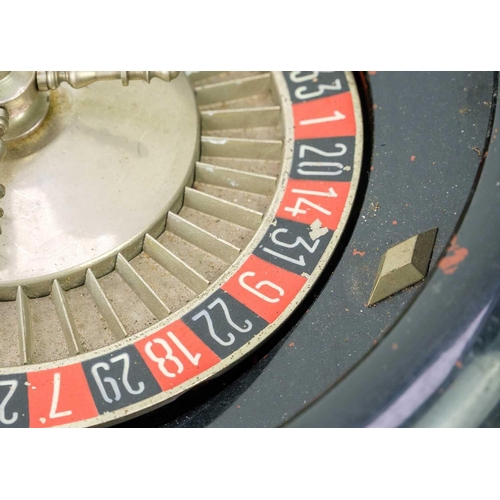 44 - A table top roulette spinning wheel by R.P. & F. Paris. Diameter 35cm, together with a child's toy s... 