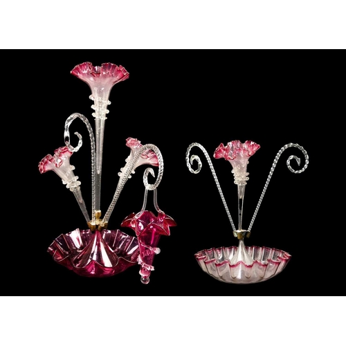 444 - A late Victorian cranberry tinted four flute epergne. On a scalloped base, height 52cm, together wit... 