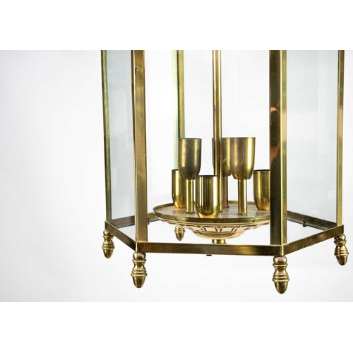 469 - A glazed brass hexagonal hall lantern. Later 20th century, each with six lamps, height 73cm (2).