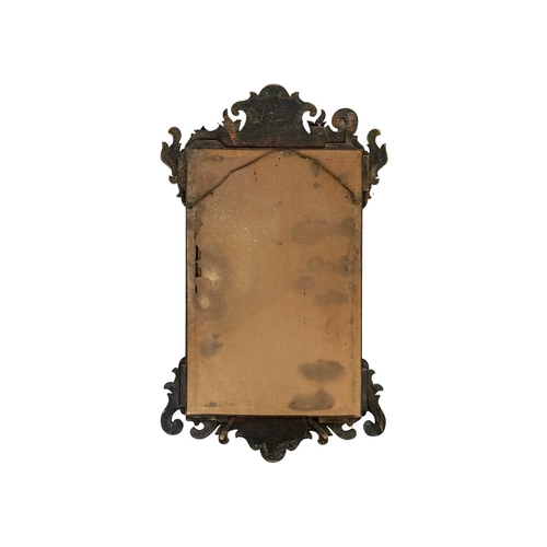 471 - A George III mahogany fretwork wall mirror. The rectangular plate with a moulded gilt slip, height 6... 