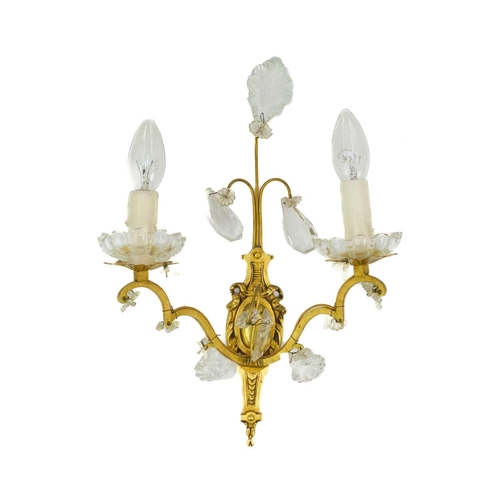 477 - A pair of gilt metal twin branch wall lights. 20th century, with cut glass shell, spear and pendant ... 