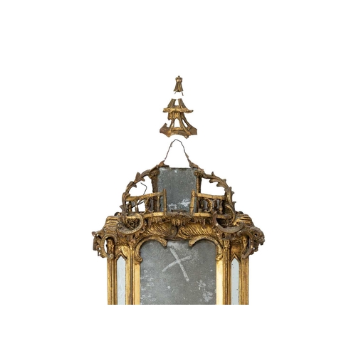 481 - A George III gilt gesso and carved wood wall mirror. In the Chinese Chippendale taste, the galleried... 