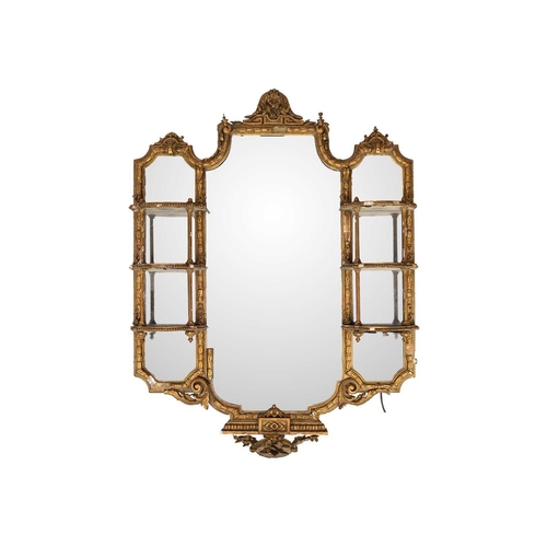 482 - A late Victorian gilt gesso wall mirror. The central plate flanked by shaped shelves, with turned an... 