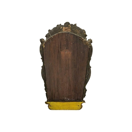 485 - An 18th century baroque wood carved gesso gilt mirror. 77cm x 47cm.