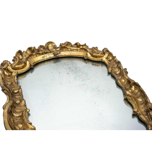 485 - An 18th century baroque wood carved gesso gilt mirror. 77cm x 47cm.