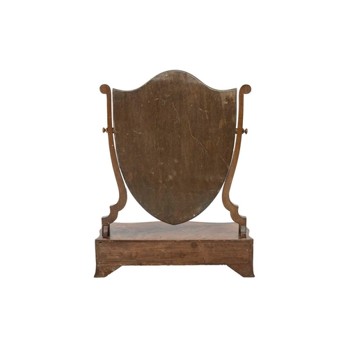 488 - A late George III mahogany dressing table mirror. With a shield shape mirror, the serpentine shaped ... 